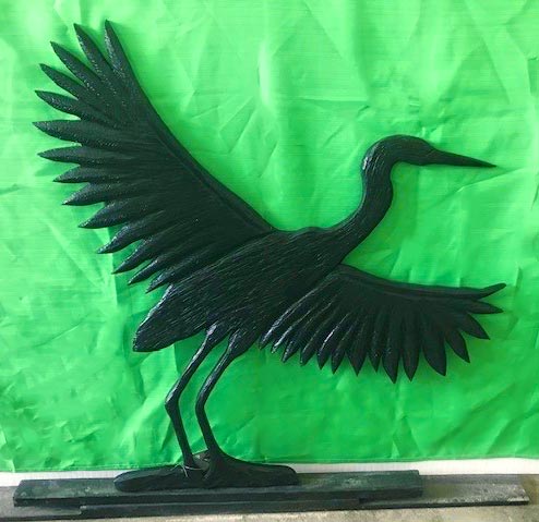 wooden carving of a heron, by Vancouver Island wood carver West Coast Wood Creations