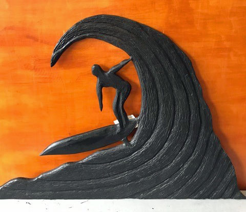 wooden carved surfer on wave by Vancouver Island wood carver Kim Reavley