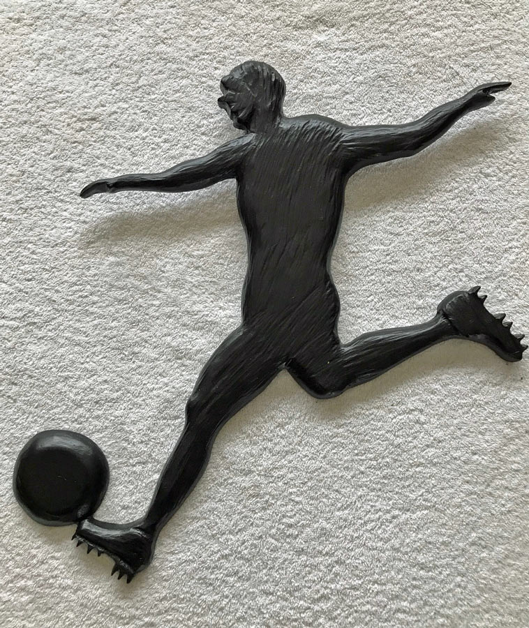 wood carving of soccer player, made in Canada by West Coast Wood Creations
