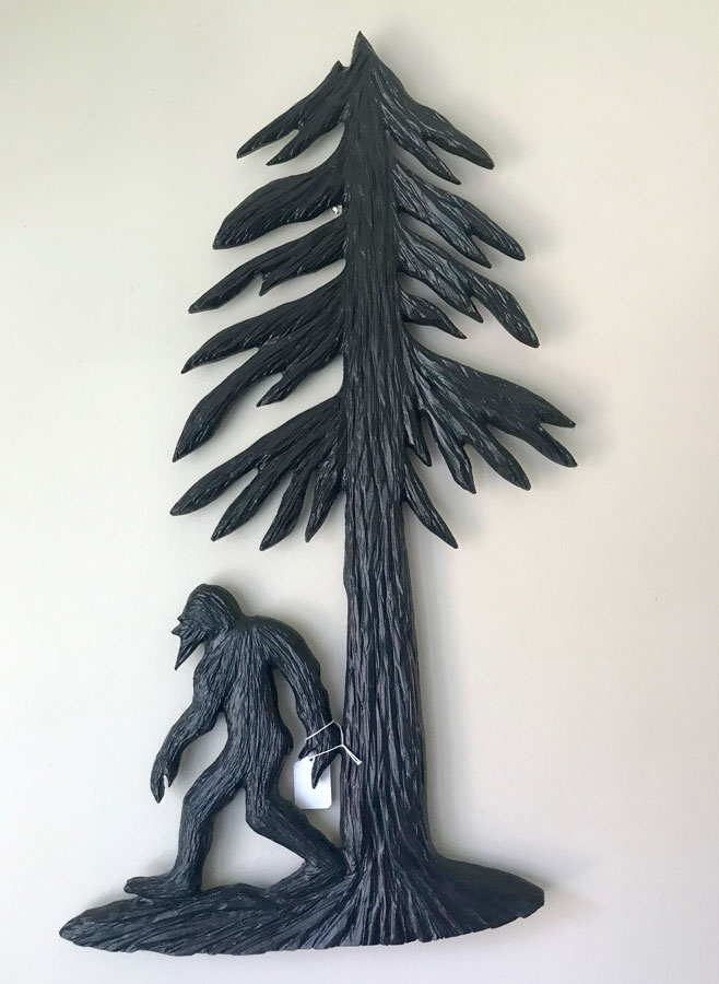 Wood Carving of Vancouver Island sasquatch Big Foot with fir tree, carved by Nanaimo Artist Kim Reavley
