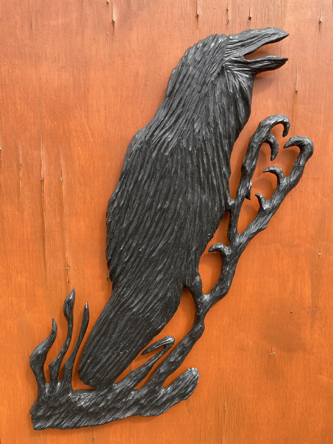 Wood carving of crow by Canadian woodworker Kim Reavley