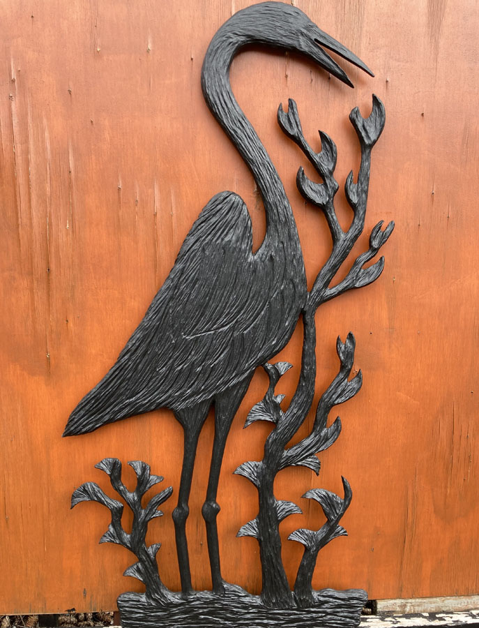 Wood carving of a blue heron by Vancouver Island Woodworker Kim Reavley